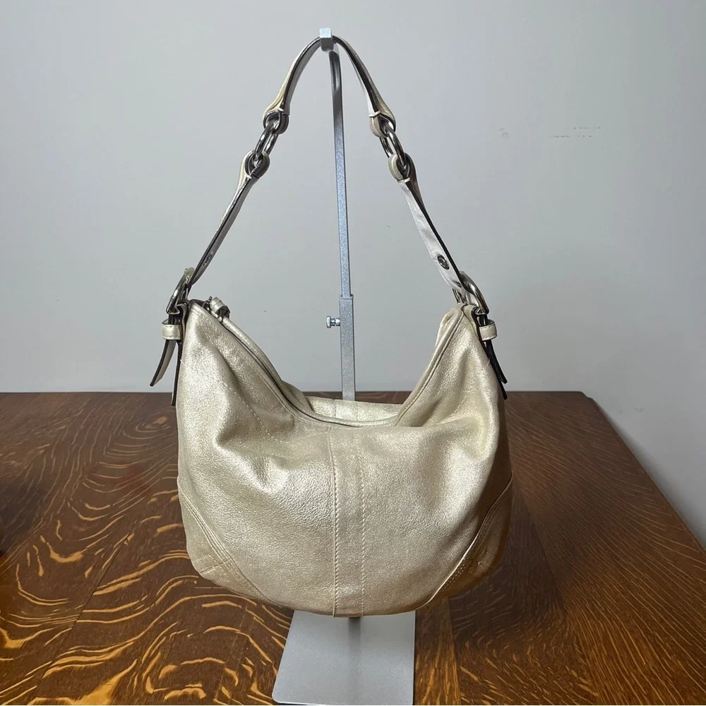 Coach Gold GOAT Leather Hobo Bag with gold tassel
